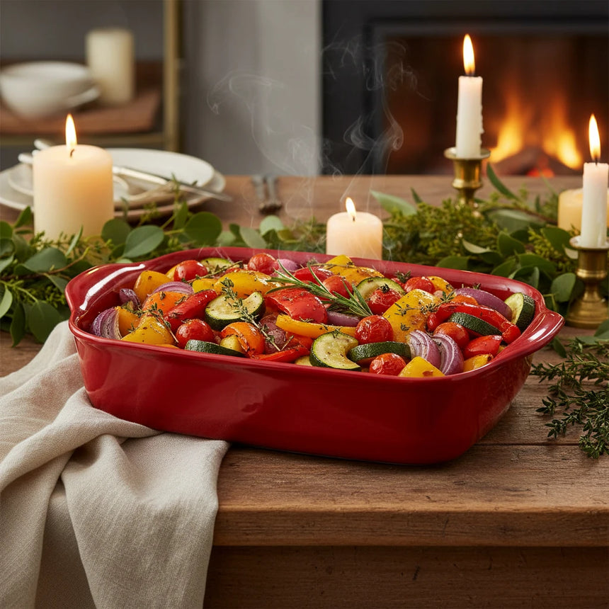 Red ceramic baking dish on a white background