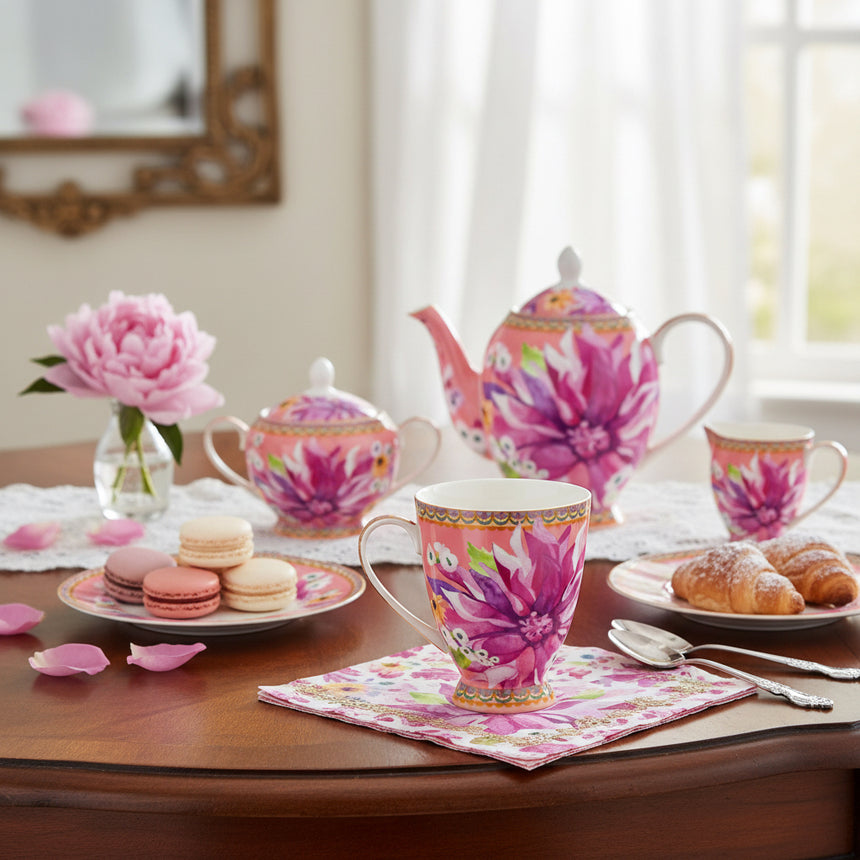 Colorful floral mug with a decorative handle on a white background