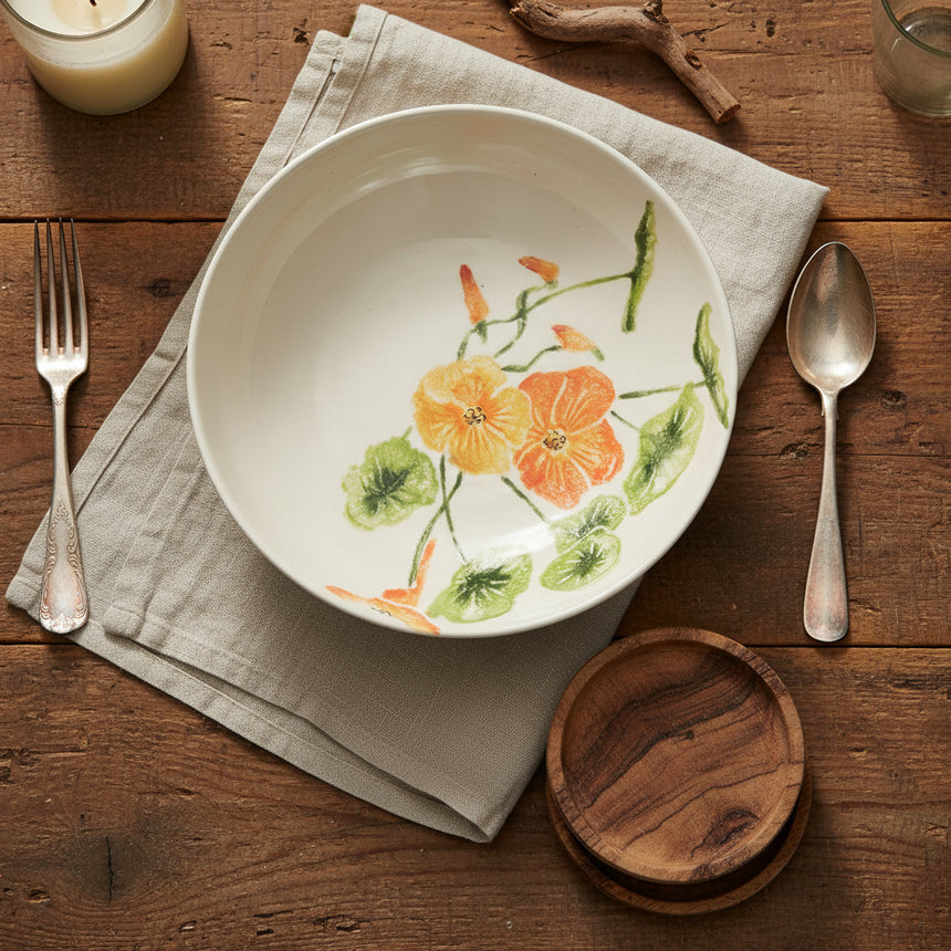 A high-quality earthenware supper plate with a hand-printed illustration of colorful nasturtium flowers on a white background.