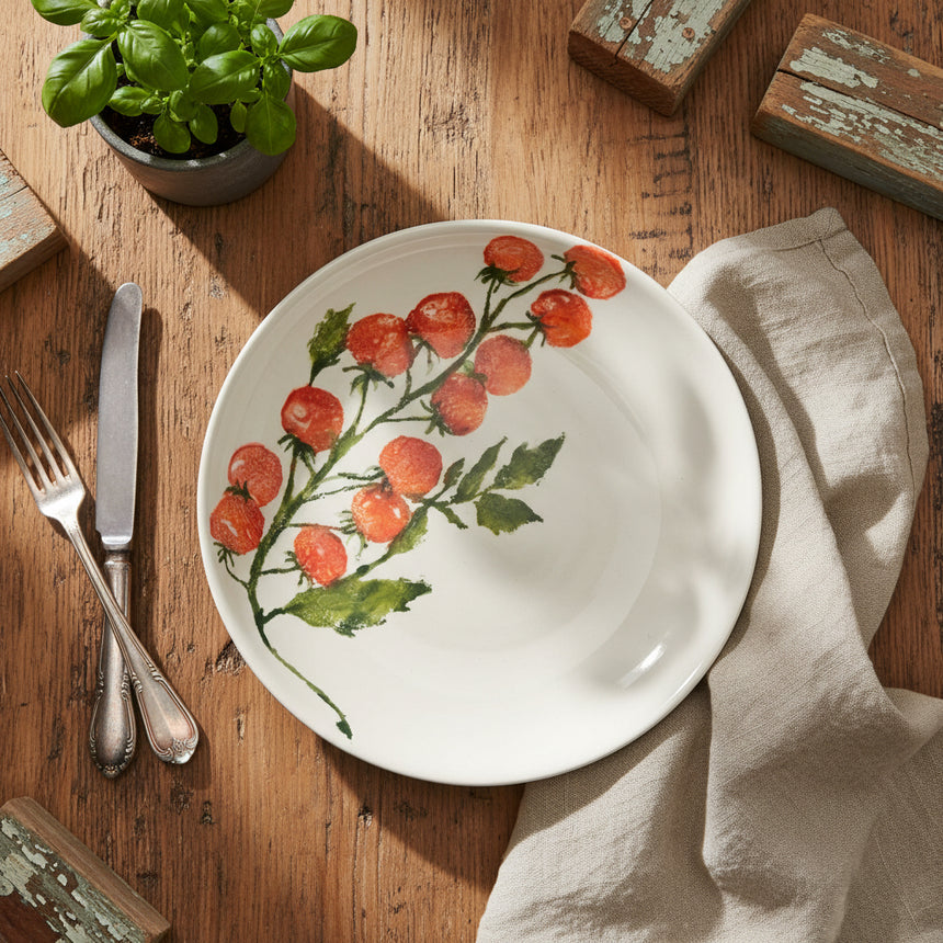 Ceramic plate with red floral design on a white background