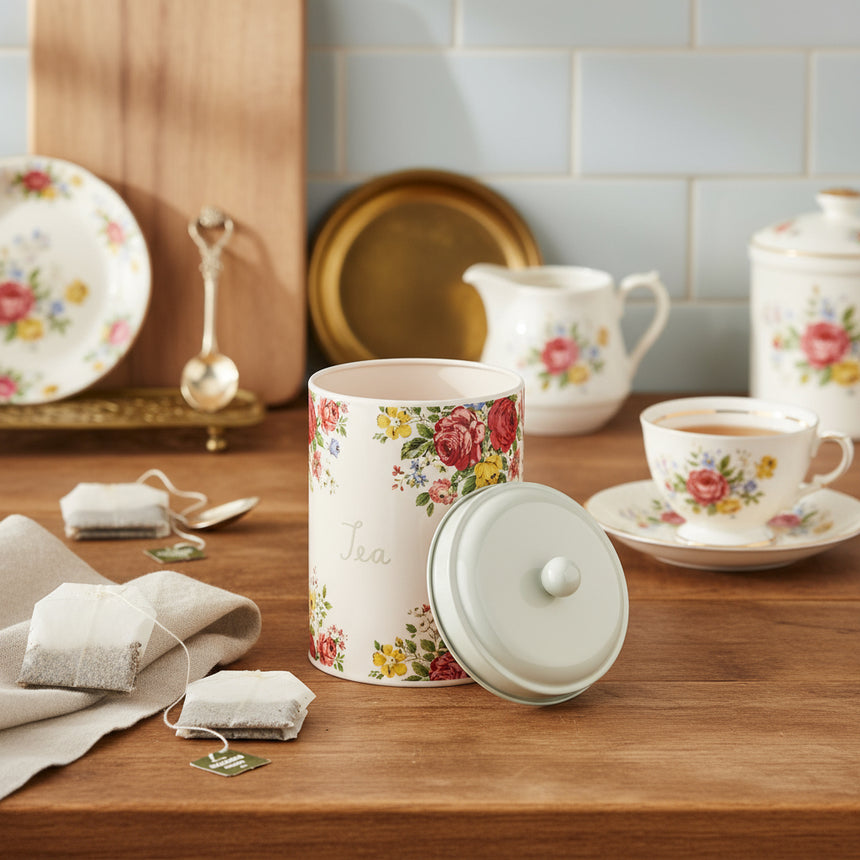 Floral-patterned tea canister on a white background