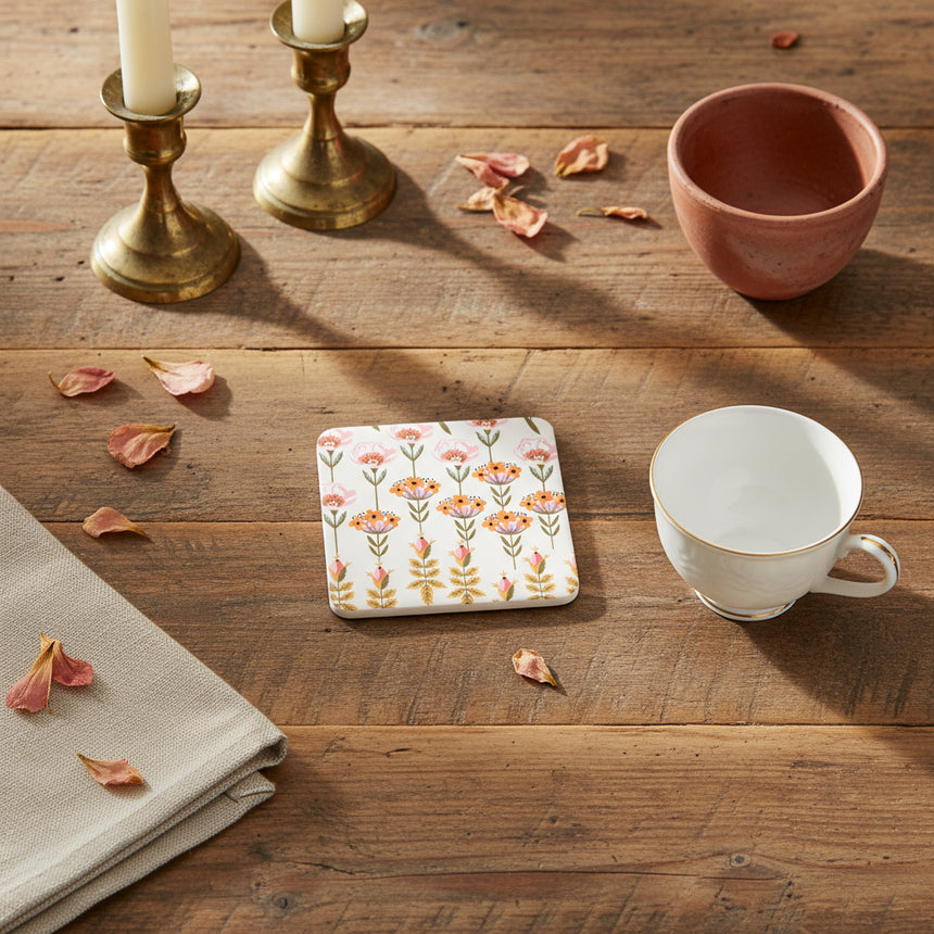 Square coaster, with floral design on a white background