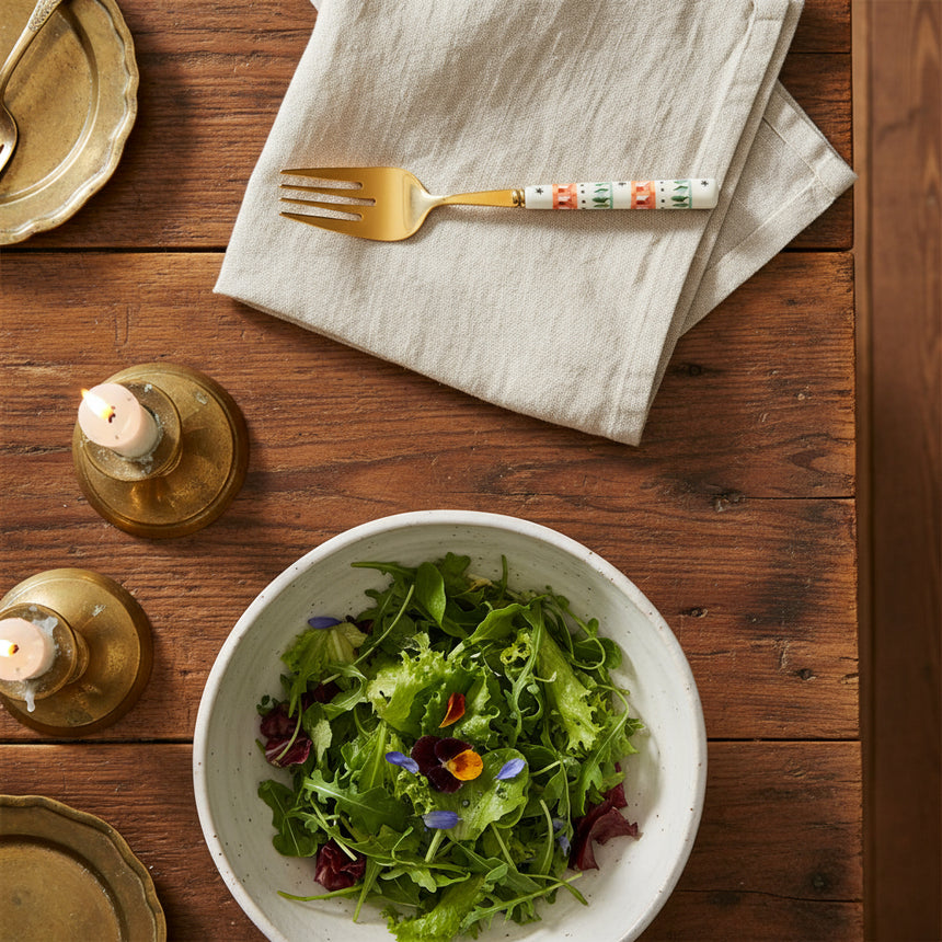 Decorative fork with a patterned handle on a white background