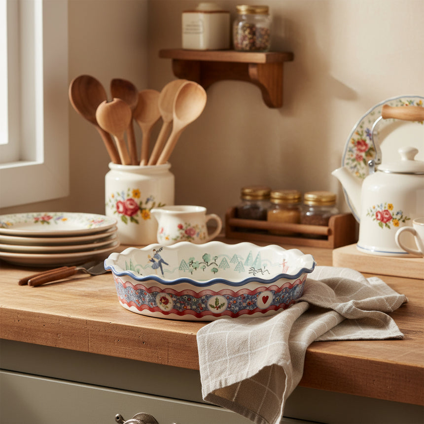 Decorative ceramic pie dish with a colorful pattern on a white background