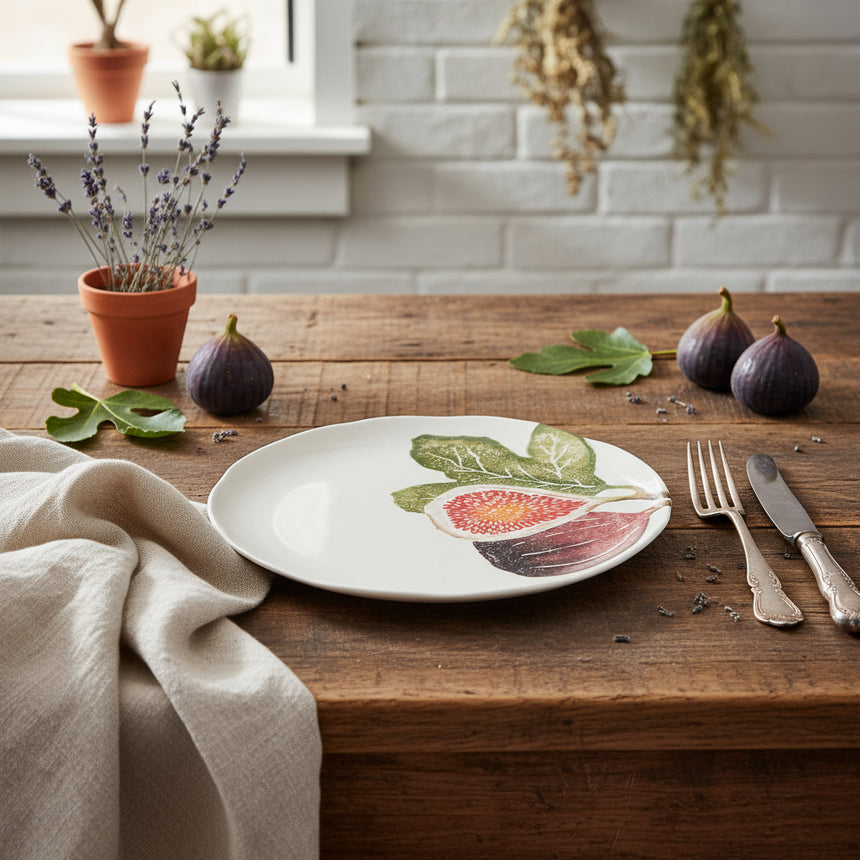 Round ceramic plate with fig illustration on a white background