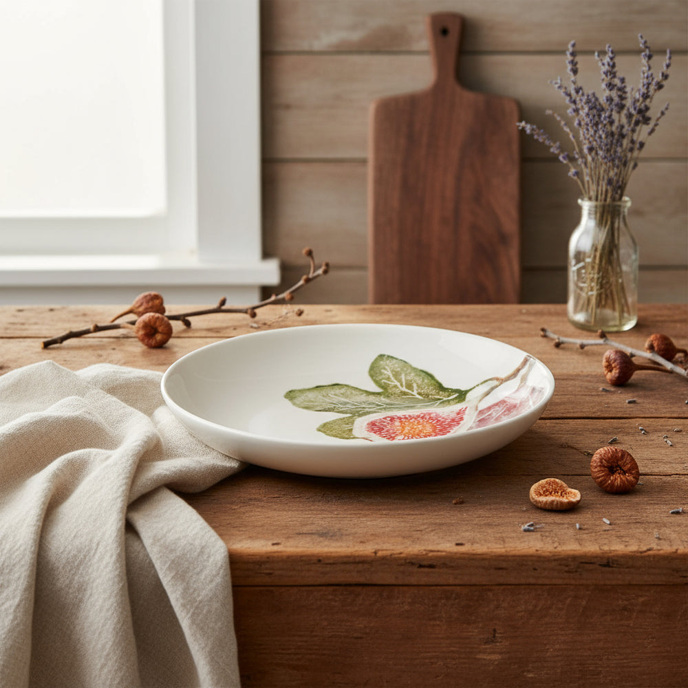White ceramic plate with fig design on a white background