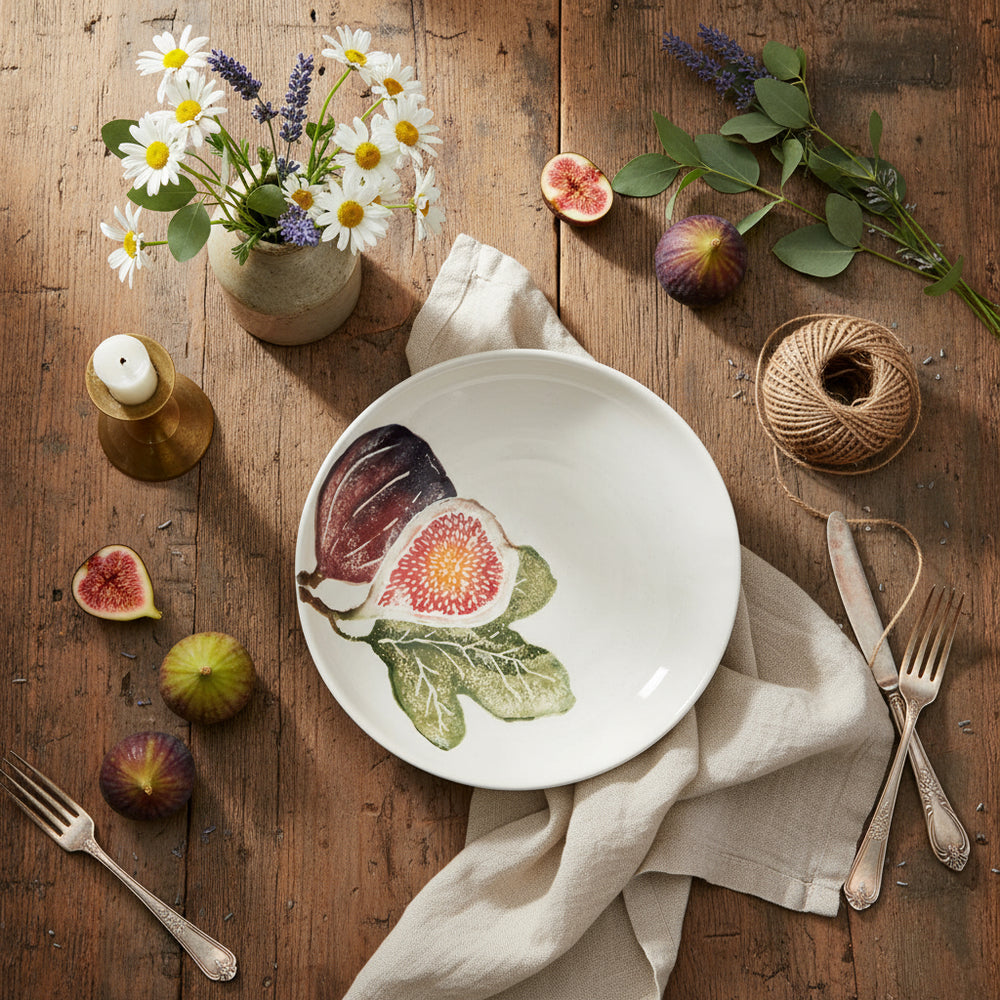 White ceramic plate with fig illustrations on a white background