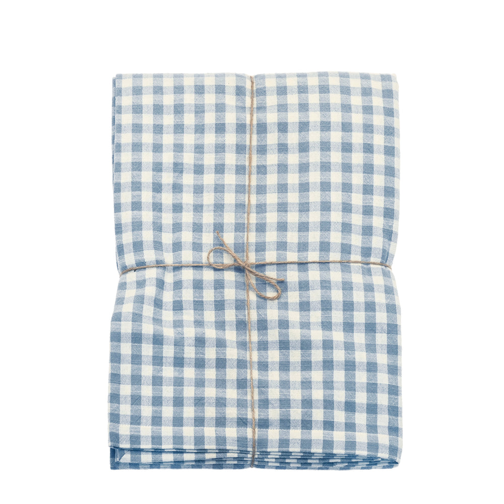 Gingham cotton tablecloth in blue and white,  presented on a white background.