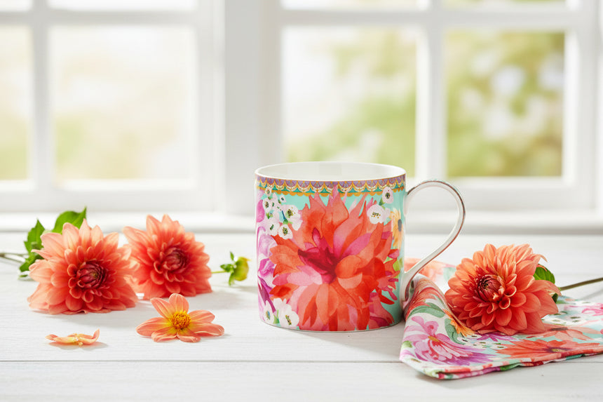 Colorful mug with floral design on a white background