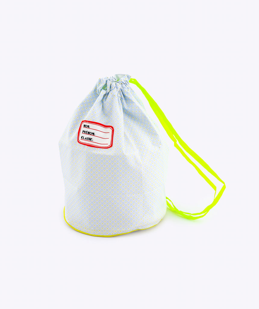 Light blue drawstring bag with a red label on a white background