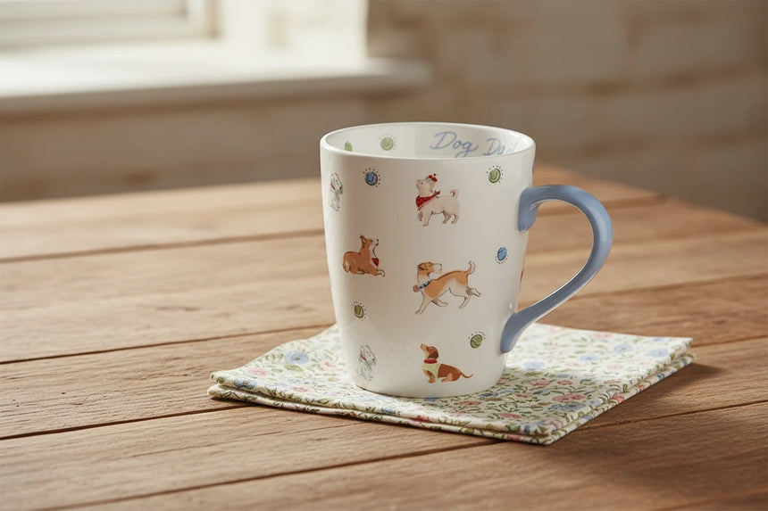 Mug with dog illustrations and 'Dog Dad' text on a white background