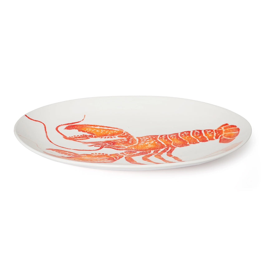 White plate with a red lobster design on a white background