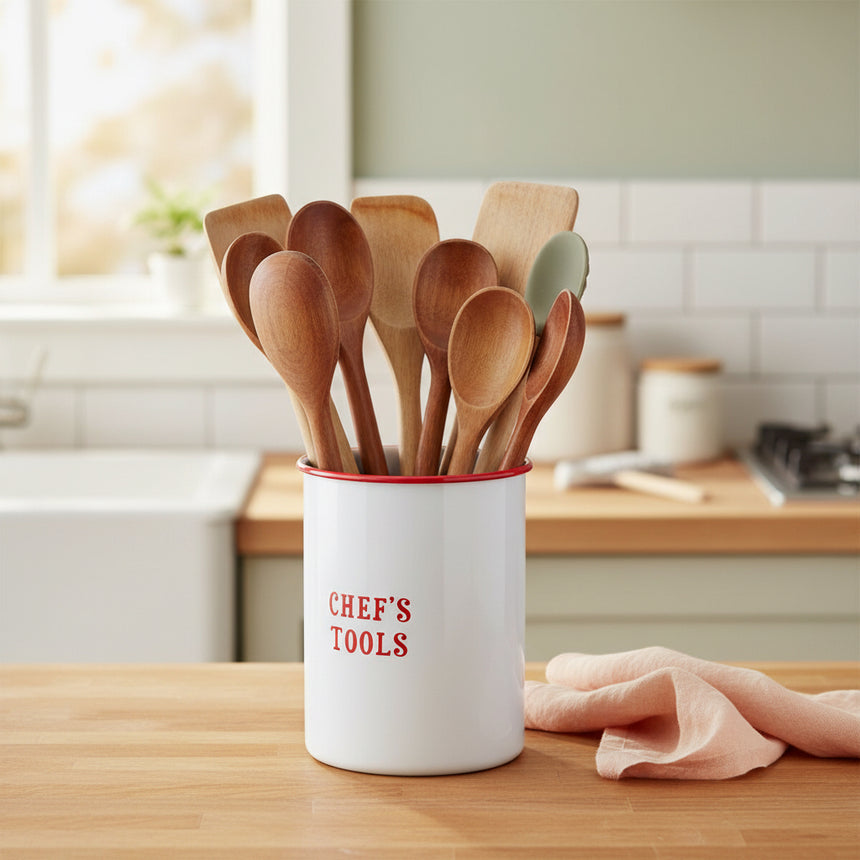 Metal utensils holder on a white background