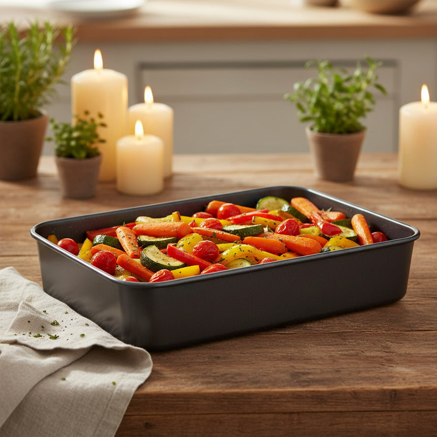 Black rectangular baking tray on a white background
