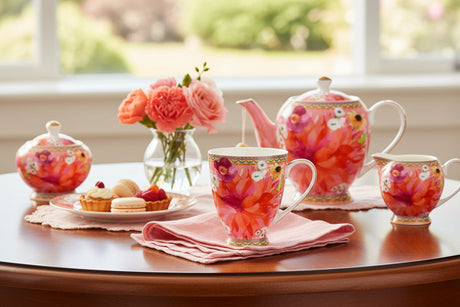 Colorful floral mug with a decorative handle on a white background