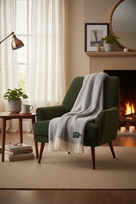 sky blue textured throw blanket with white fringe and Bronte label on a white background