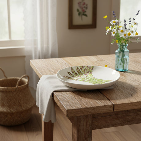 Ceramic plate with asparagus design on a white background