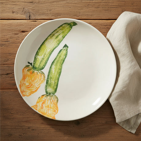 Round ceramic plate with illustrations of zucchinis on a white background