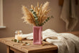 Pink rectangular vase with 'London Brick' text on a white background