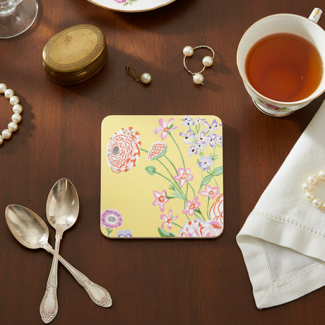 Floral coaster with colorful flowers on a yellow background