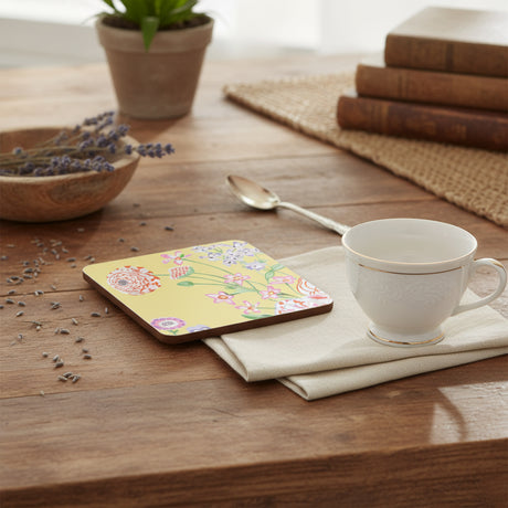 Floral coaster with colorful flowers on a yellow background