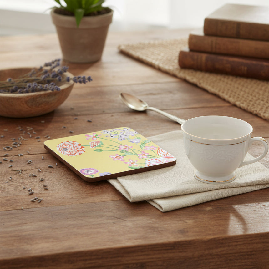 Floral coaster with colorful flowers on a yellow background