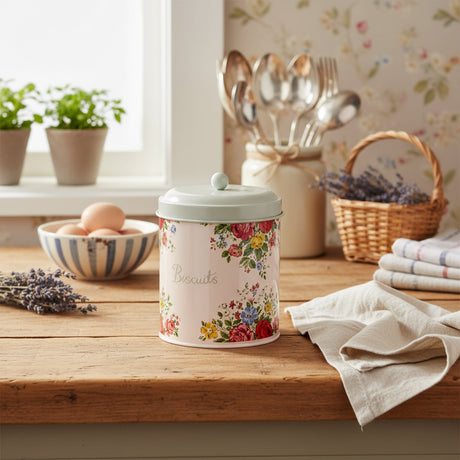 Floral-patterned cookie jar on a white background