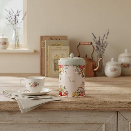 Floral-patterned tea canister on a white background