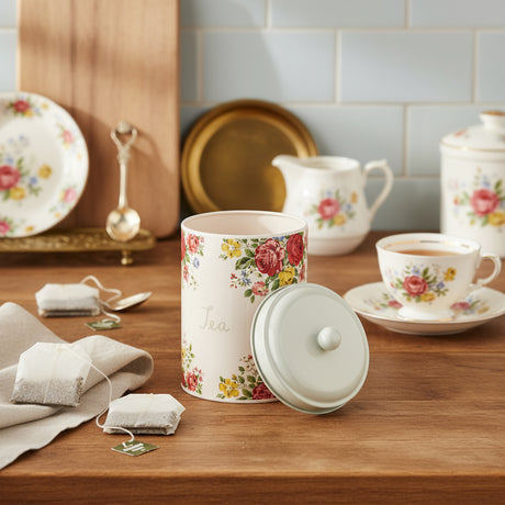 Floral-patterned tea canister on a white background