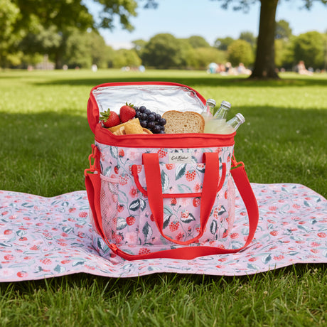 Floral-patterned cooler bag with red accents on a light gray background