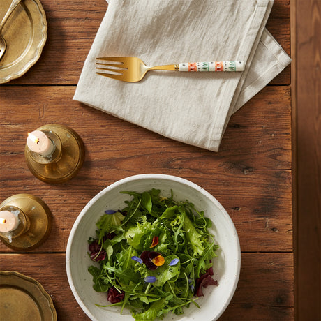 Decorative fork with a patterned handle on a white background