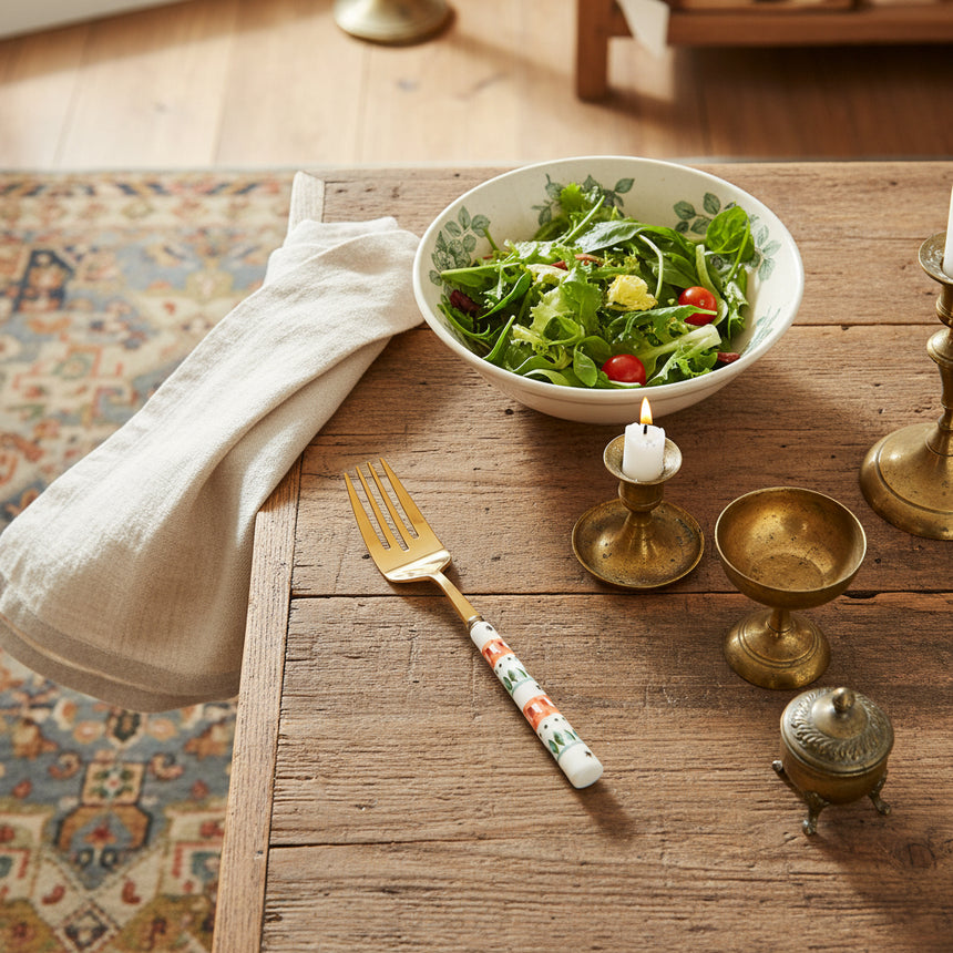 Decorative fork with a patterned handle on a white background
