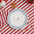Round plate with a polar bear design and blue decorative border on a white background
