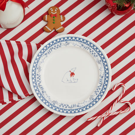 Round plate with a polar bear design and blue decorative border on a white background