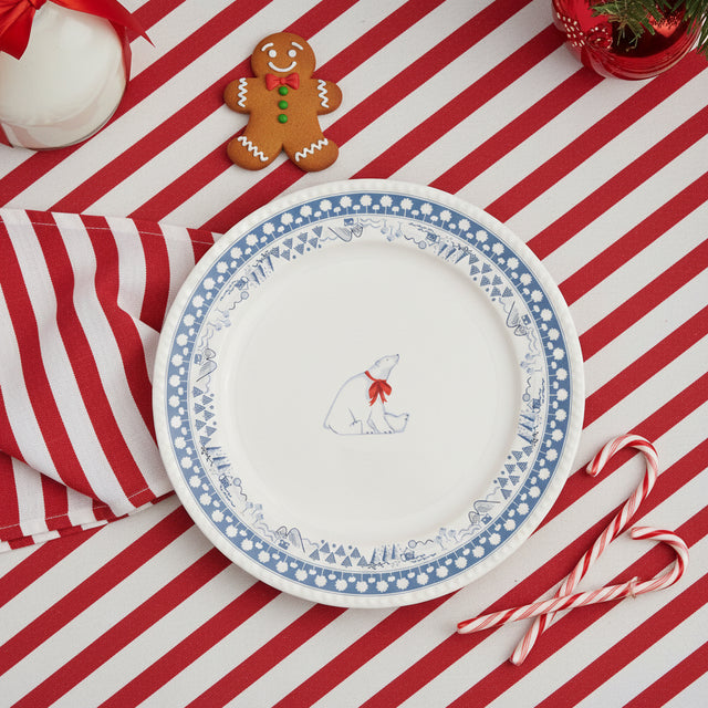 Round plate with a polar bear design and blue decorative border on a white background