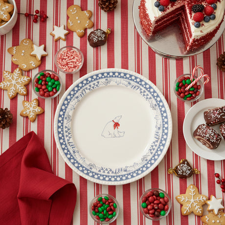 Round plate with a polar bear design and blue decorative border on a white background