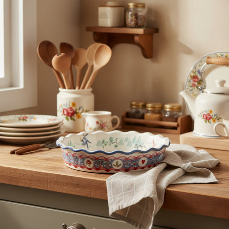 Decorative ceramic pie dish with a colorful pattern on a white background