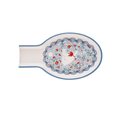 Decorative spoon rest with floral design and polar bear  illustration on a white background