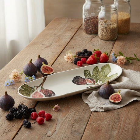 Decorative ceramic bowl with fig design on a white background