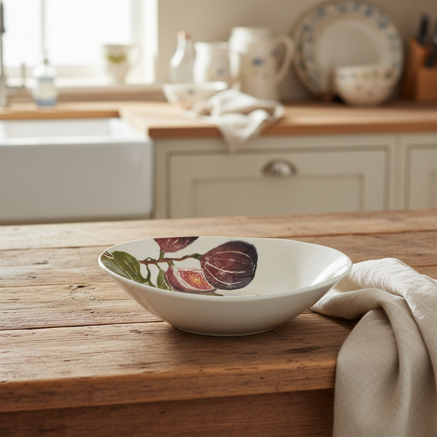 White ceramic bowl with fig design on a white background