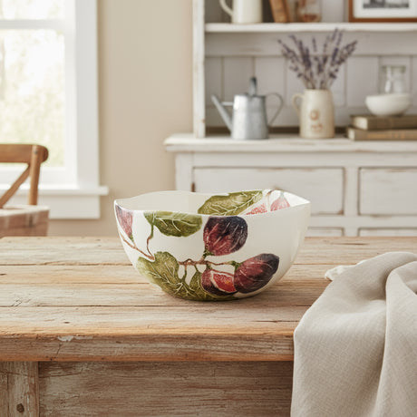 Ceramic bowl with leaf pattern on a white background