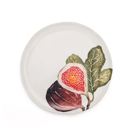 Round ceramic plate with a fig design on a white background