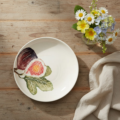 White ceramic plate with fig illustrations on a white background