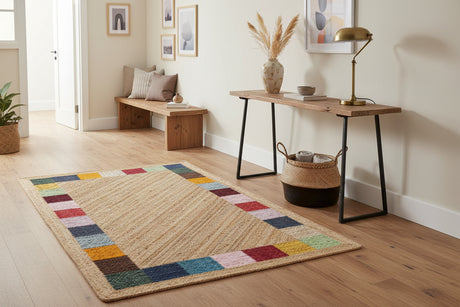 Beige jute rug with multicolored border on a white background