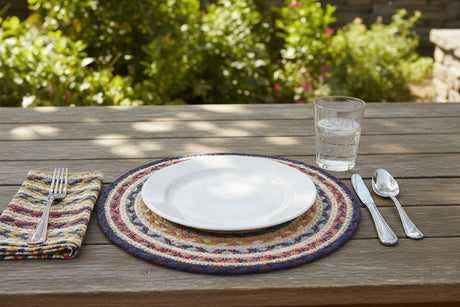 Round braided placemats with multicolor pattern on a white background