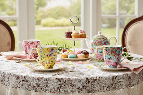 Three floral-patterned mugs on a white background