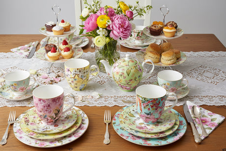 Three floral-patterned mugs on a white background