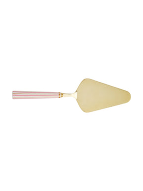 Gold cake server with pink handle on a white background
