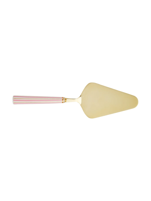 Gold cake server with pink handle on a white background