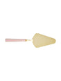 Gold cake server with pink handle on a white background